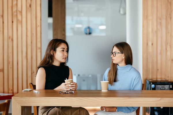 Two women talking in a cafe